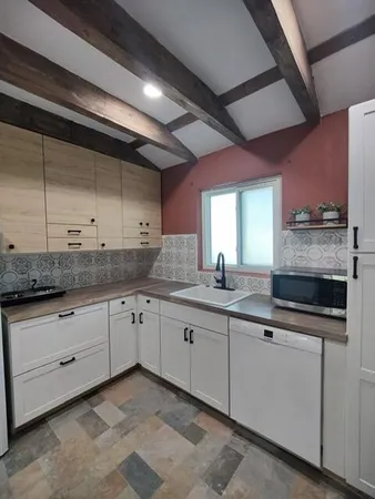 a bathroom with a sink and shower