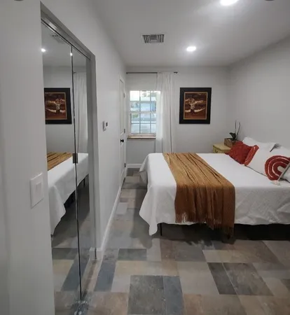 a bathroom with a glass shower door