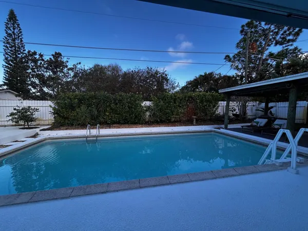 a view of balcony with furniture