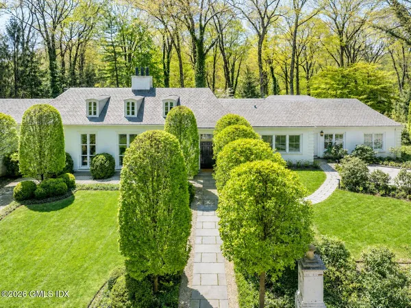 a view of a house with a garden