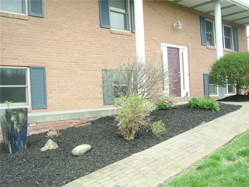110 Parker Road Sarver, PA 16055 - Photo 2 of 17 Walkway to front of home with brick walkway and beautiful landscaped and maintained beds.