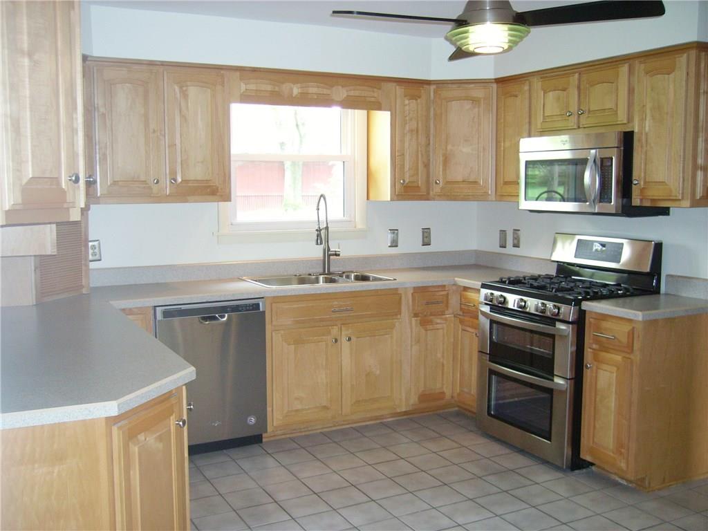 110 Parker Road Sarver, PA 16055 - Photo 9 of 17 Beautiful functional kitchen includes gas stove with double oven including convection, new dishwasher, microwave, refrigerator, and disposer.