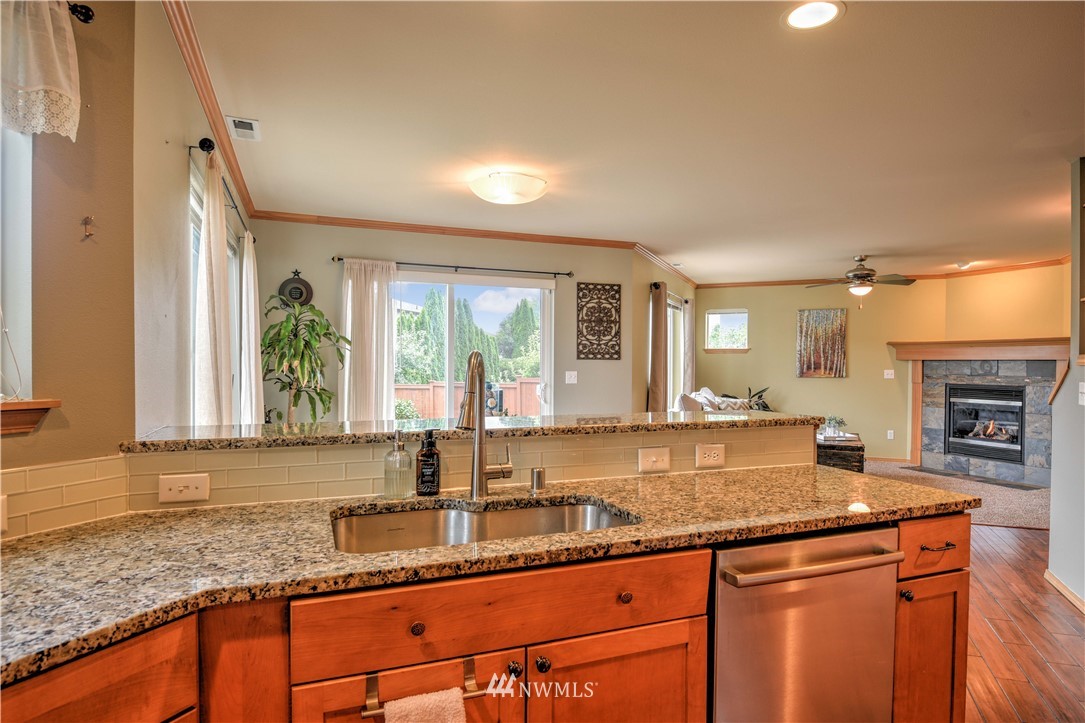 20398 Springbrook Road Southeast Monroe, WA 98272 - Photo 4 of 39 a kitchen with granite countertop a sink and a window
