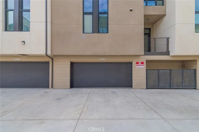 a front view of a house with garage