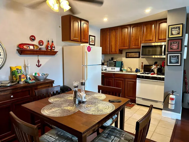 a kitchen with a dining table and chairs