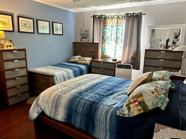 a bedroom with bed and a window