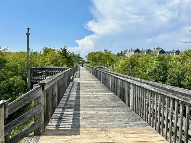 a view of a balcony with wooden fence
