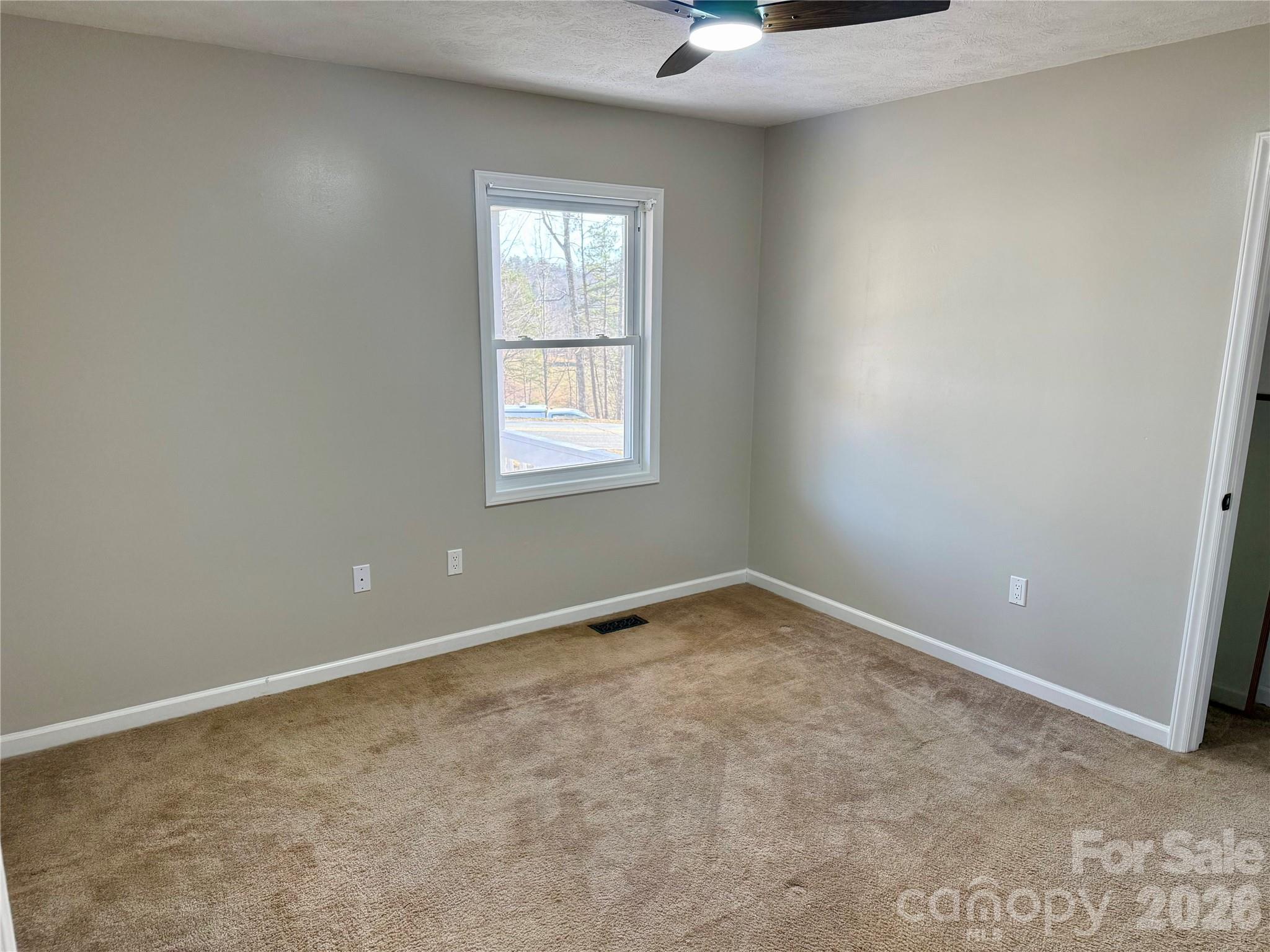628 Hidden View Loop Marion, NC 28752 - Photo 14 of 44 an empty room with a window