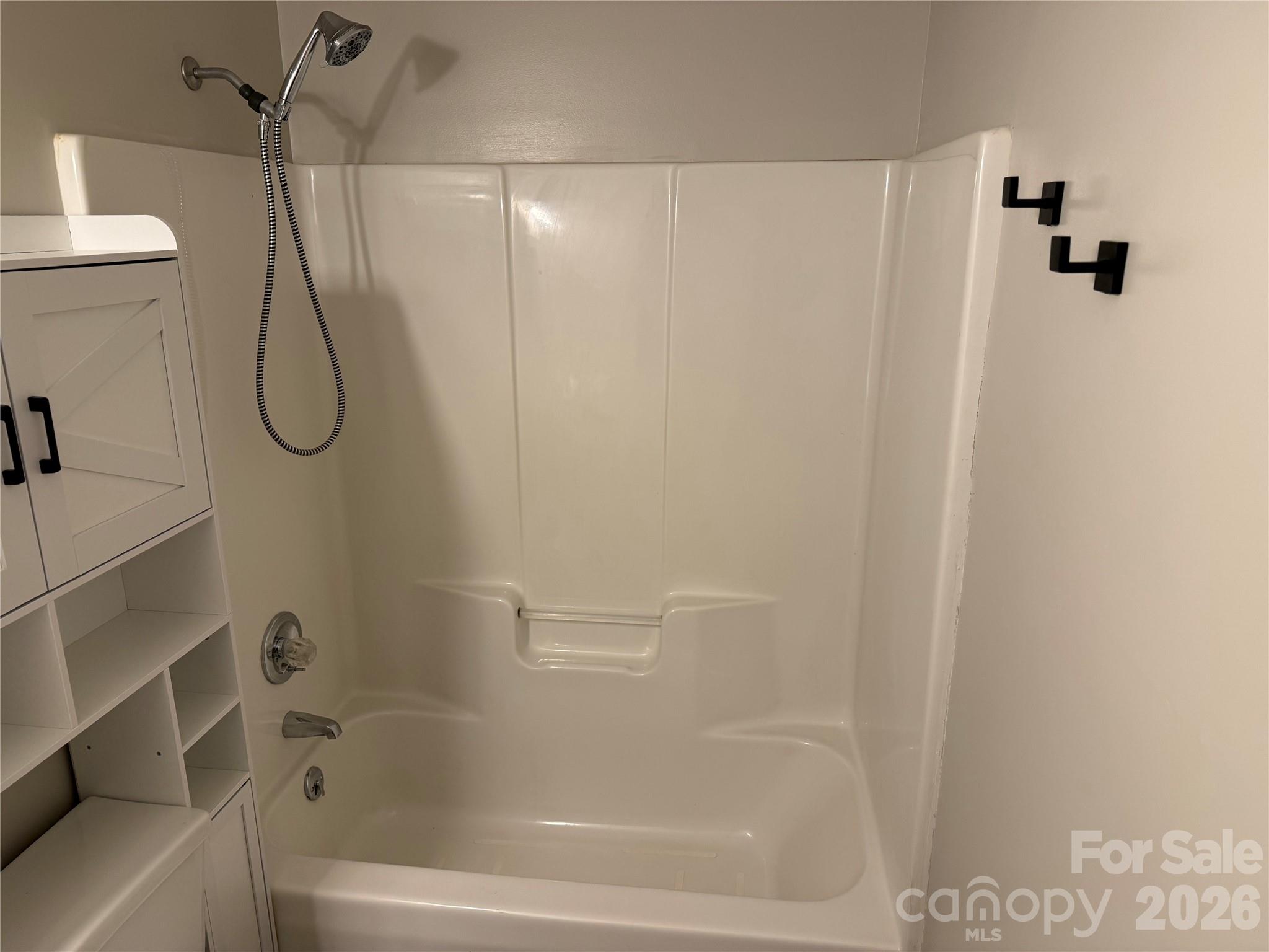 628 Hidden View Loop Marion, NC 28752 - Photo 17 of 44 a bathroom with a bath tub with a shower