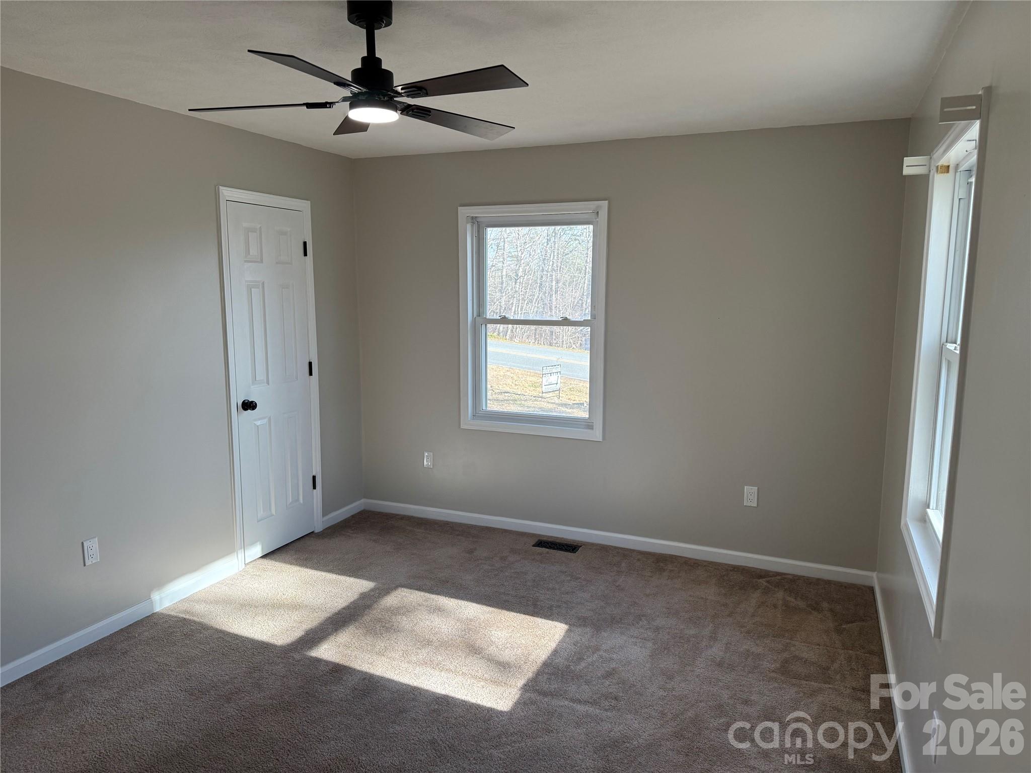 628 Hidden View Loop Marion, NC 28752 - Photo 18 of 44 a view of an empty room with a window