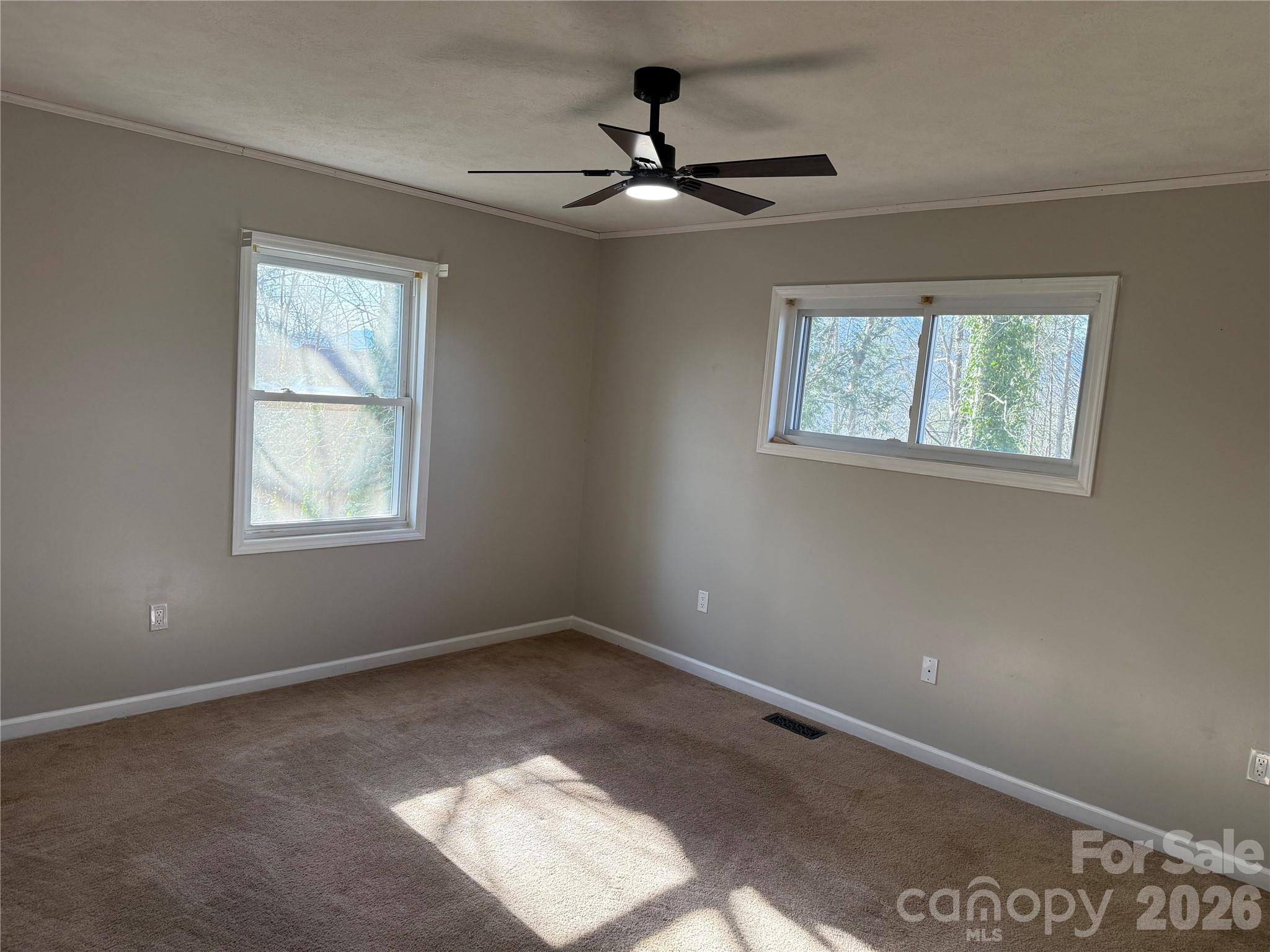 628 Hidden View Loop Marion, NC 28752 - Photo 20 of 44 a view of an empty room with a window