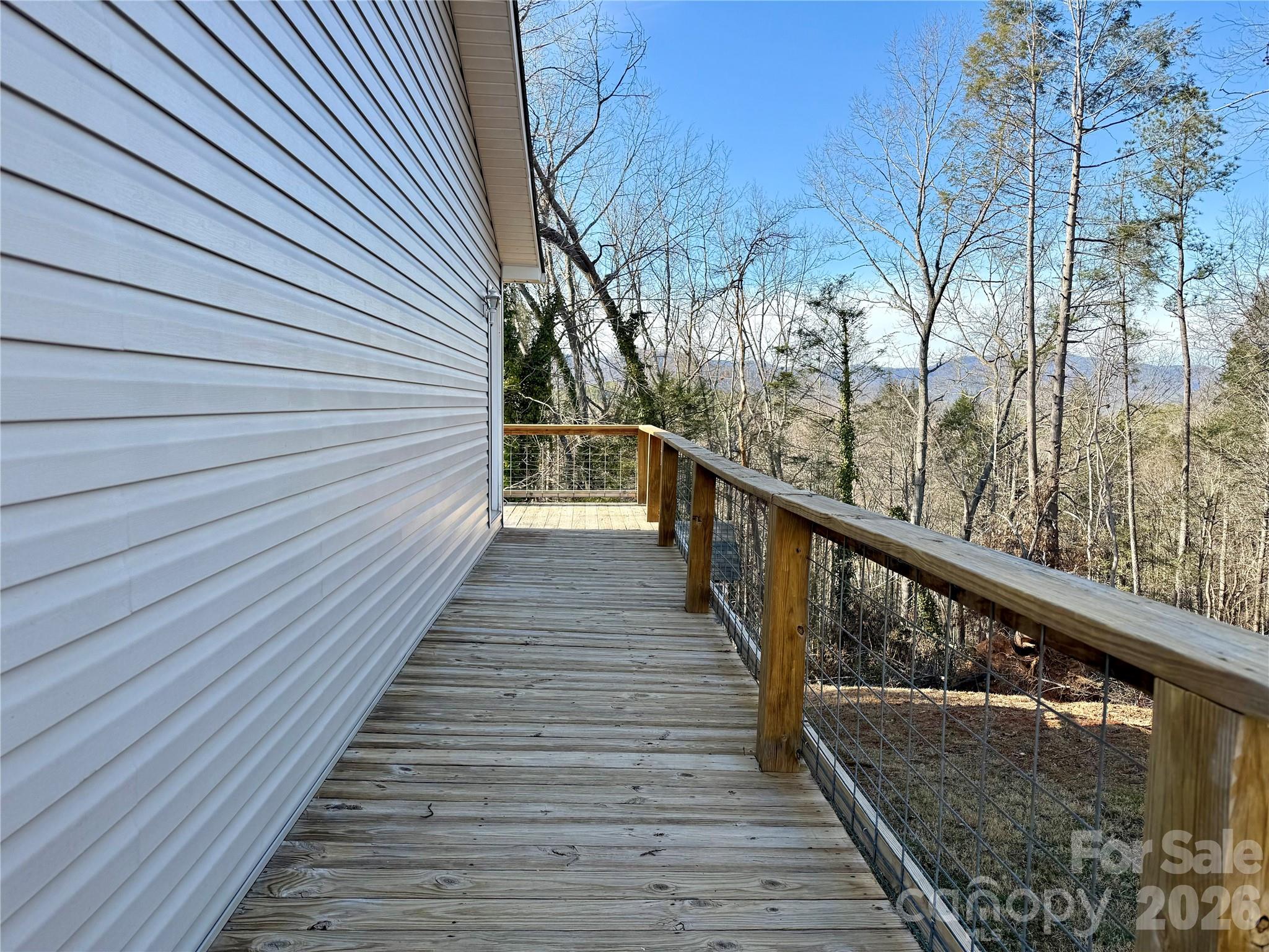 628 Hidden View Loop Marion, NC 28752 - Photo 27 of 44 a view of balcony with wooden floor
