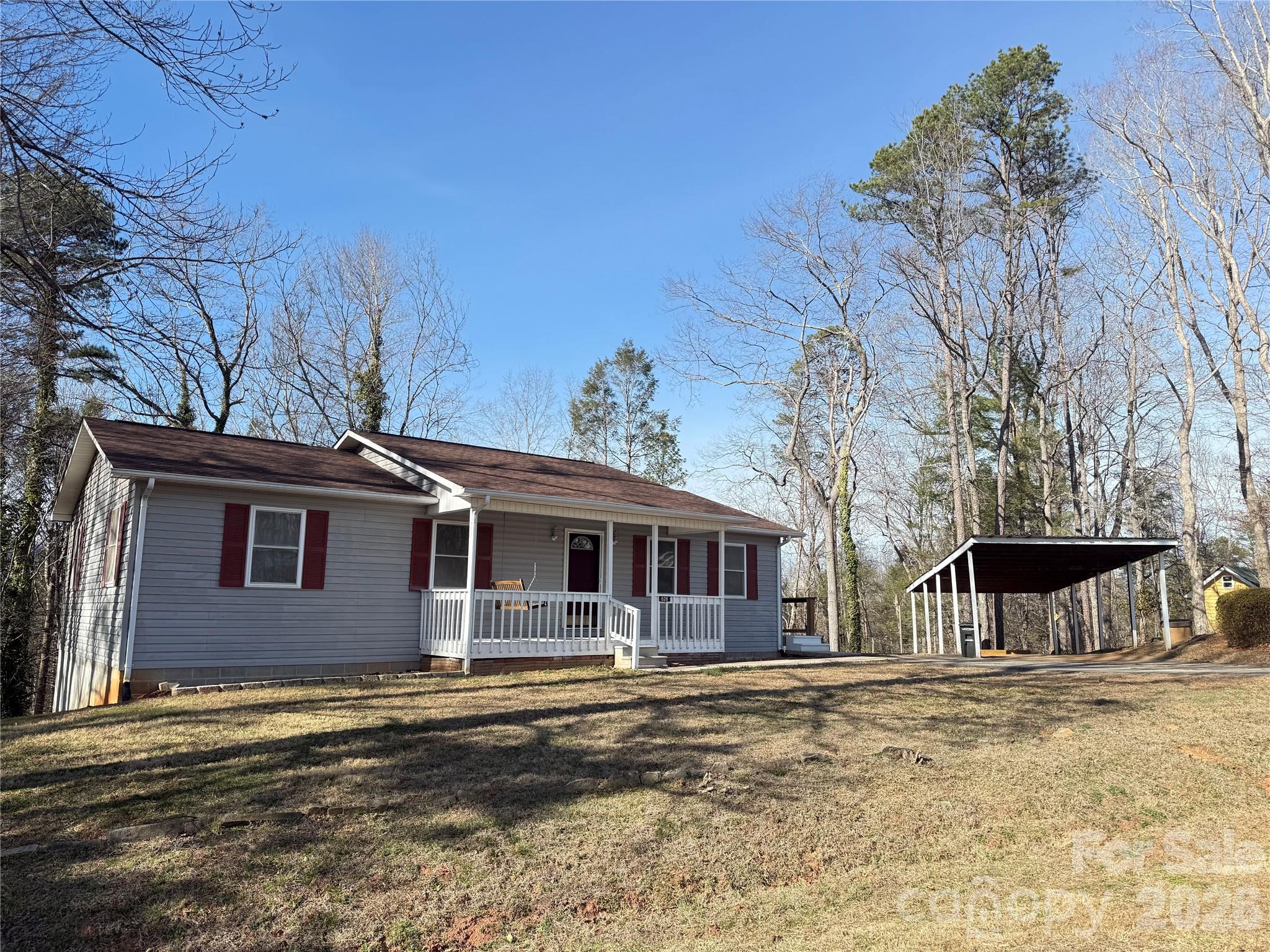 628 Hidden View Loop Marion, NC 28752 - Photo 3 of 44 a front view of a house with a yard