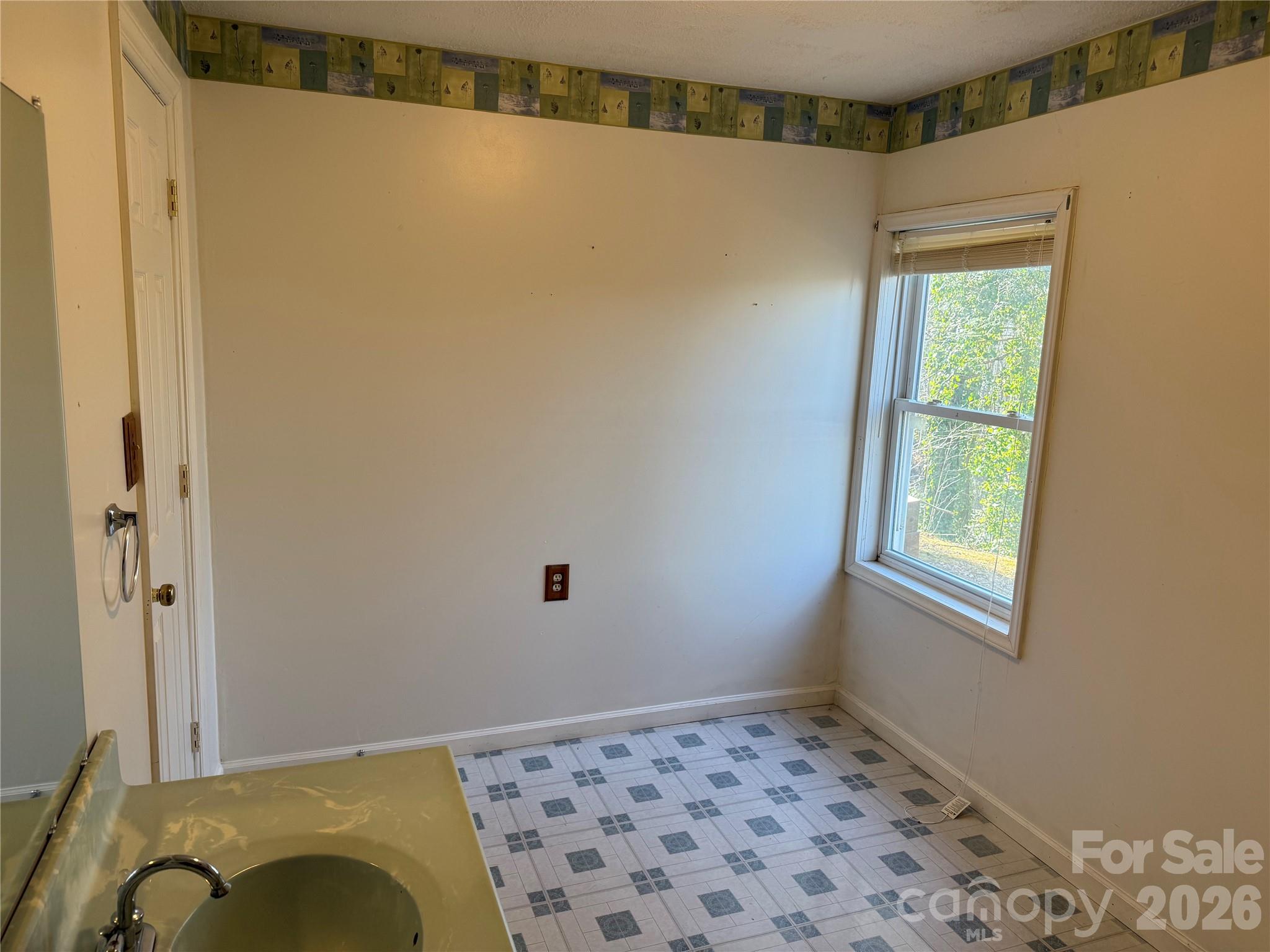 628 Hidden View Loop Marion, NC 28752 - Photo 34 of 44 a bedroom with a bed and a window