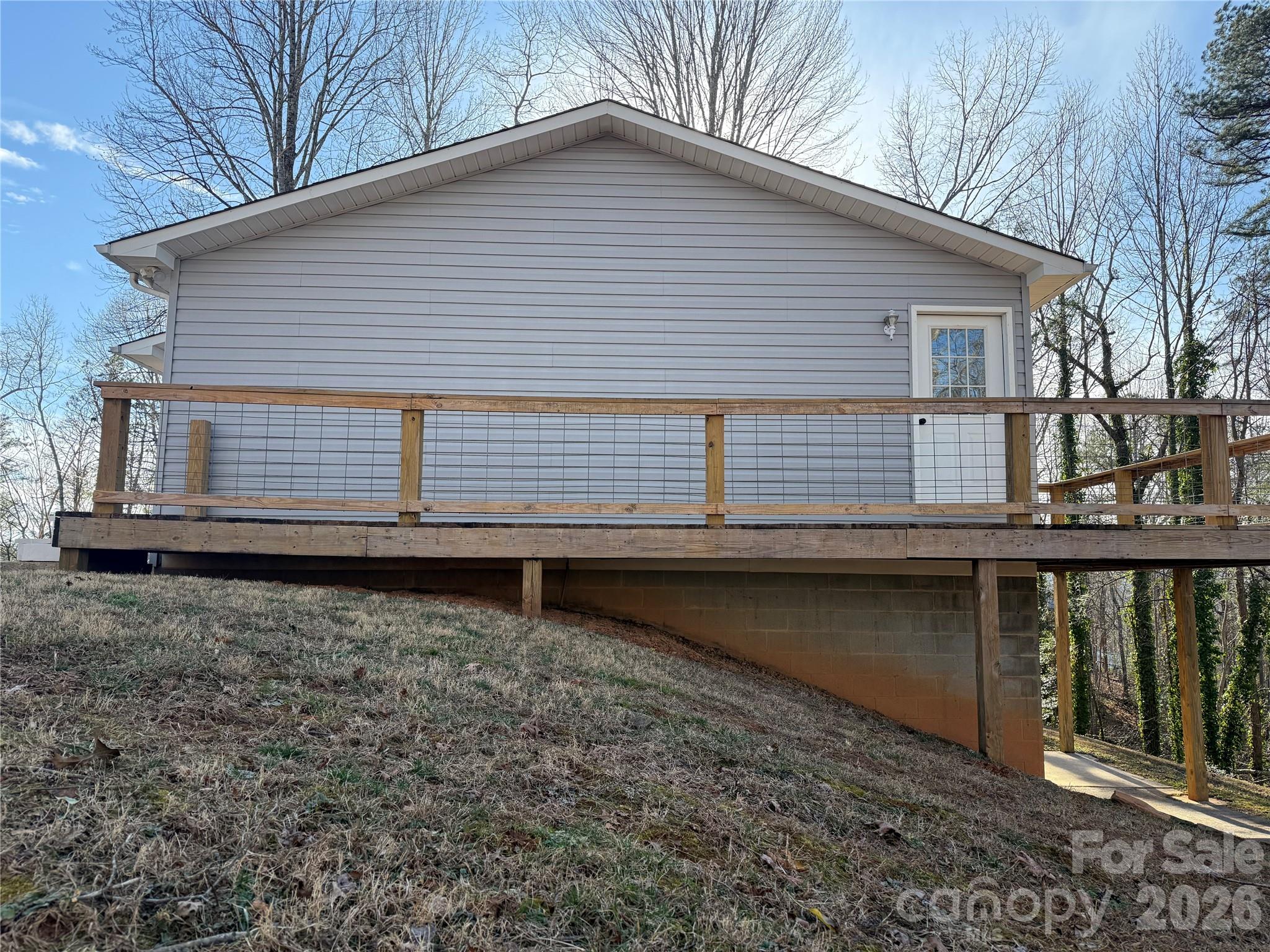 628 Hidden View Loop Marion, NC 28752 - Photo 44 of 44 a view of a small house with wooden fence