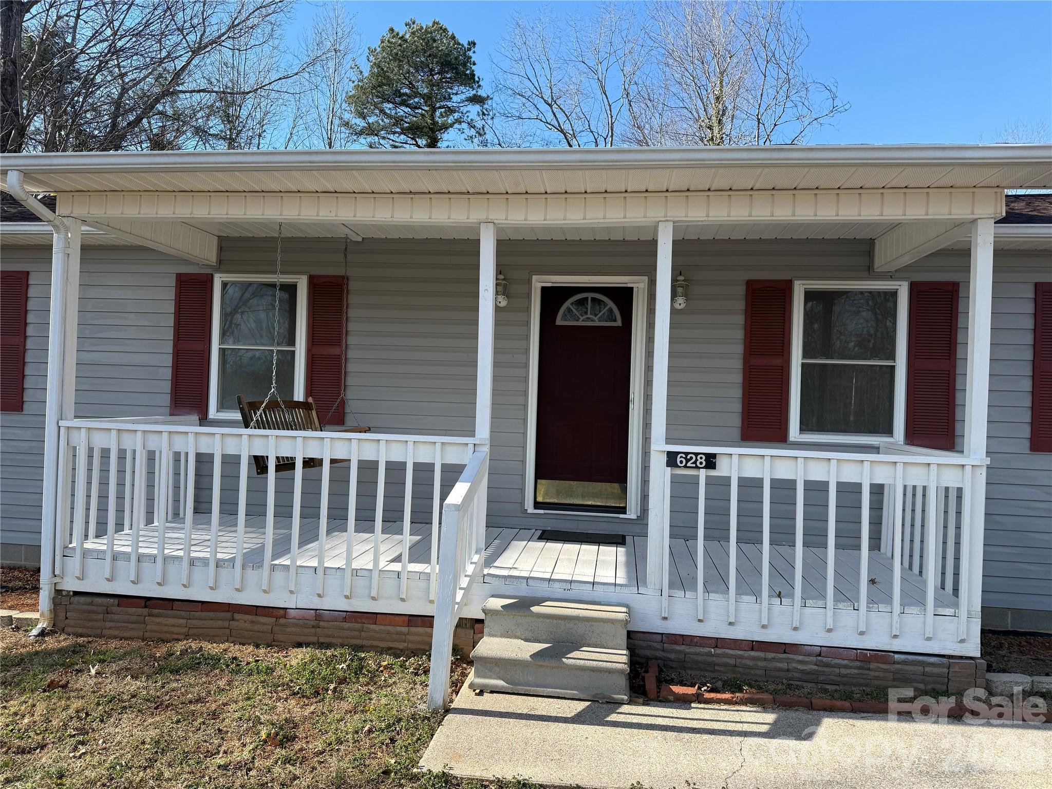628 Hidden View Loop Marion, NC 28752 - Photo 8 of 44 a view of a house with wooden fence