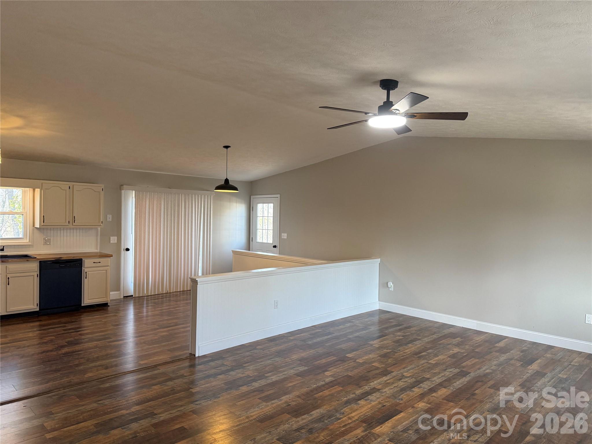 628 Hidden View Loop Marion, NC 28752 - Photo 9 of 44 a view of empty room with wooden floor and fan