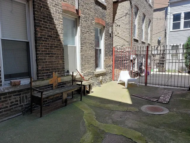 a backyard of a house with outdoor seating