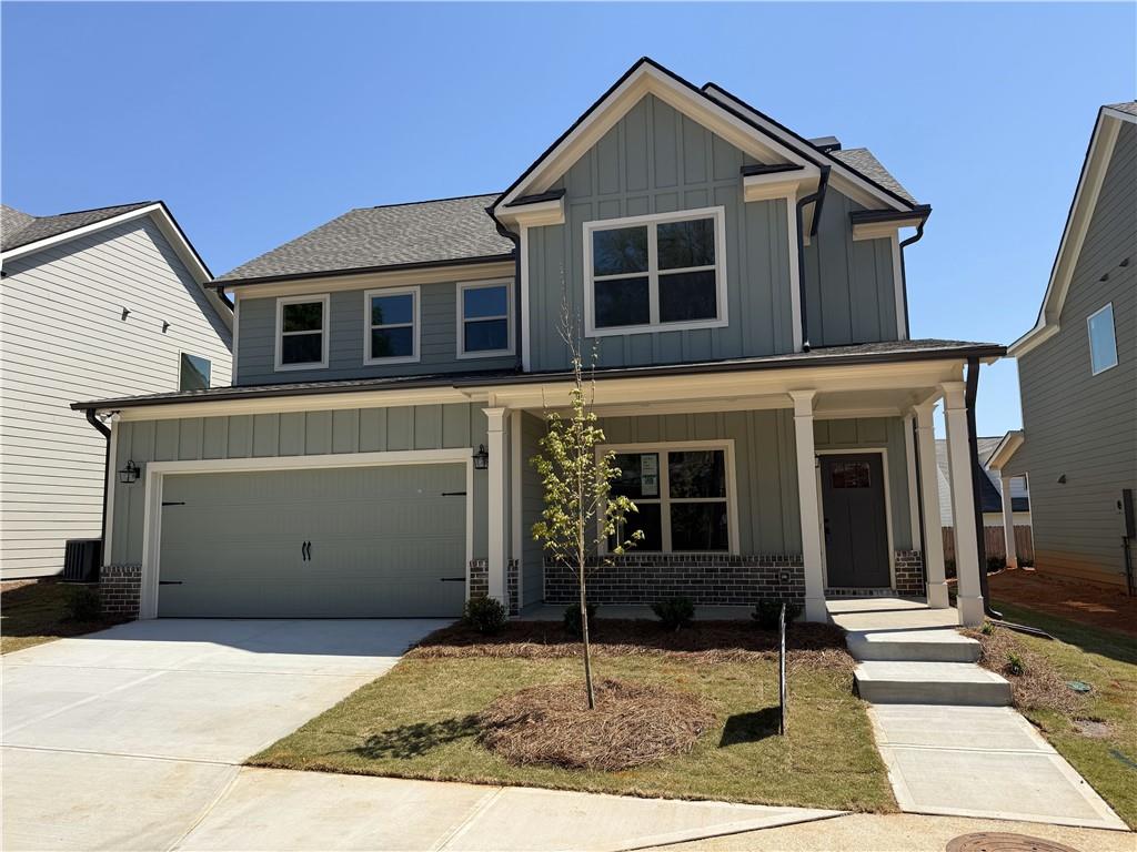 309 Ridge Pointe Drive Athens, GA 30606 - Photo 1 of 1 a front view of a house with garden