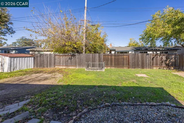 a view of a backyard with a small pool
