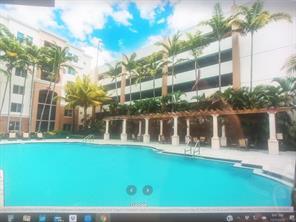 1690 Renaissance Commons Boulevard, Unit 1623 Boynton Beach, FL 33426 - Photo 2 of 9 a view of a house with a yard