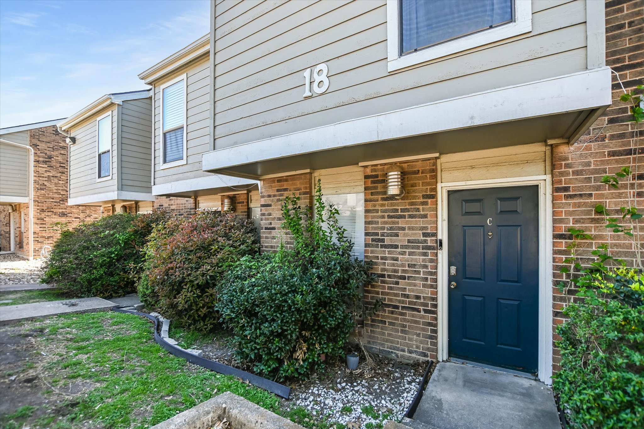 Property entrance with brick siding