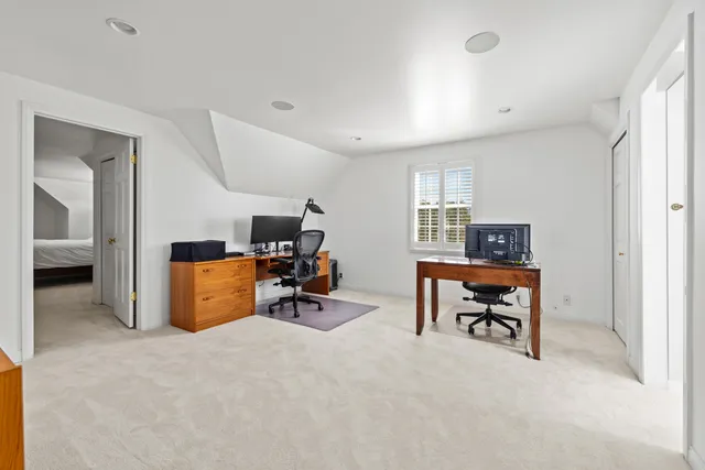 a view of a city with lush green forest