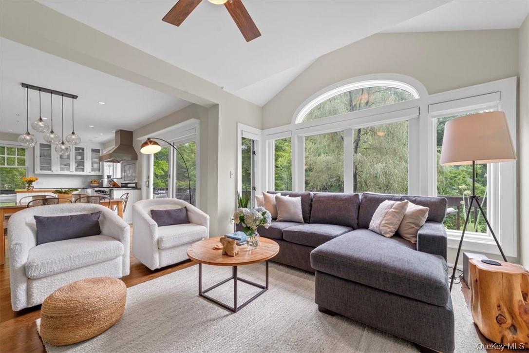 28 Inningwood Road Ossining, NY 10562 - Photo 11 of 37 Living room with high vaulted ceiling, a wealth of natural light, light wood-type flooring, and ceiling fan