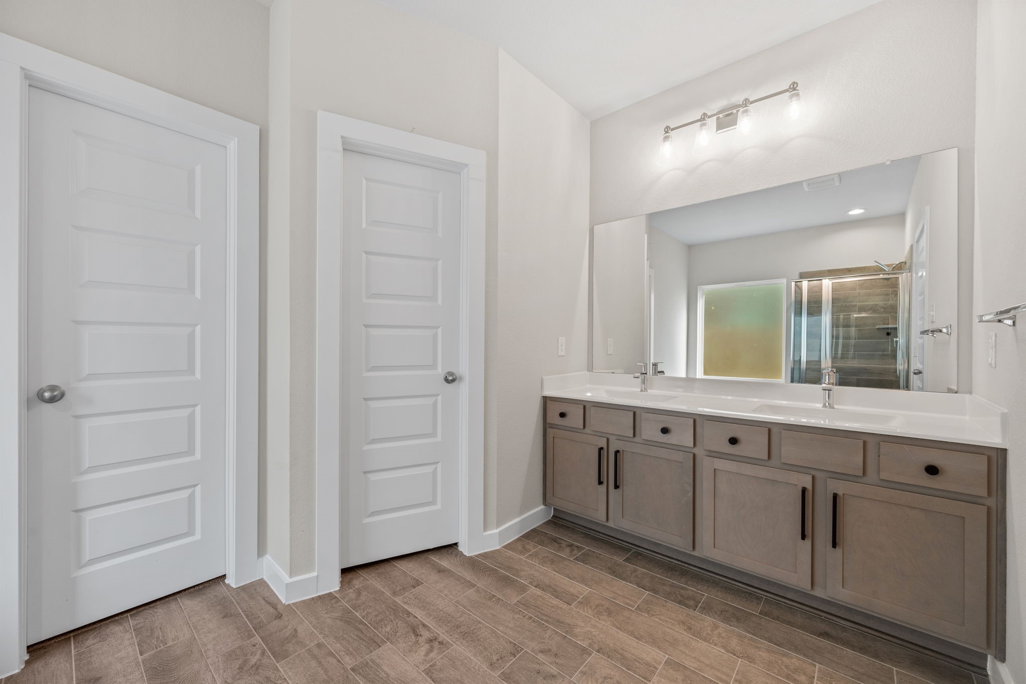 15666 Countesswells Drive Humble, TX 77346 - Photo 11 of 32 a bathroom with a sink and a mirror