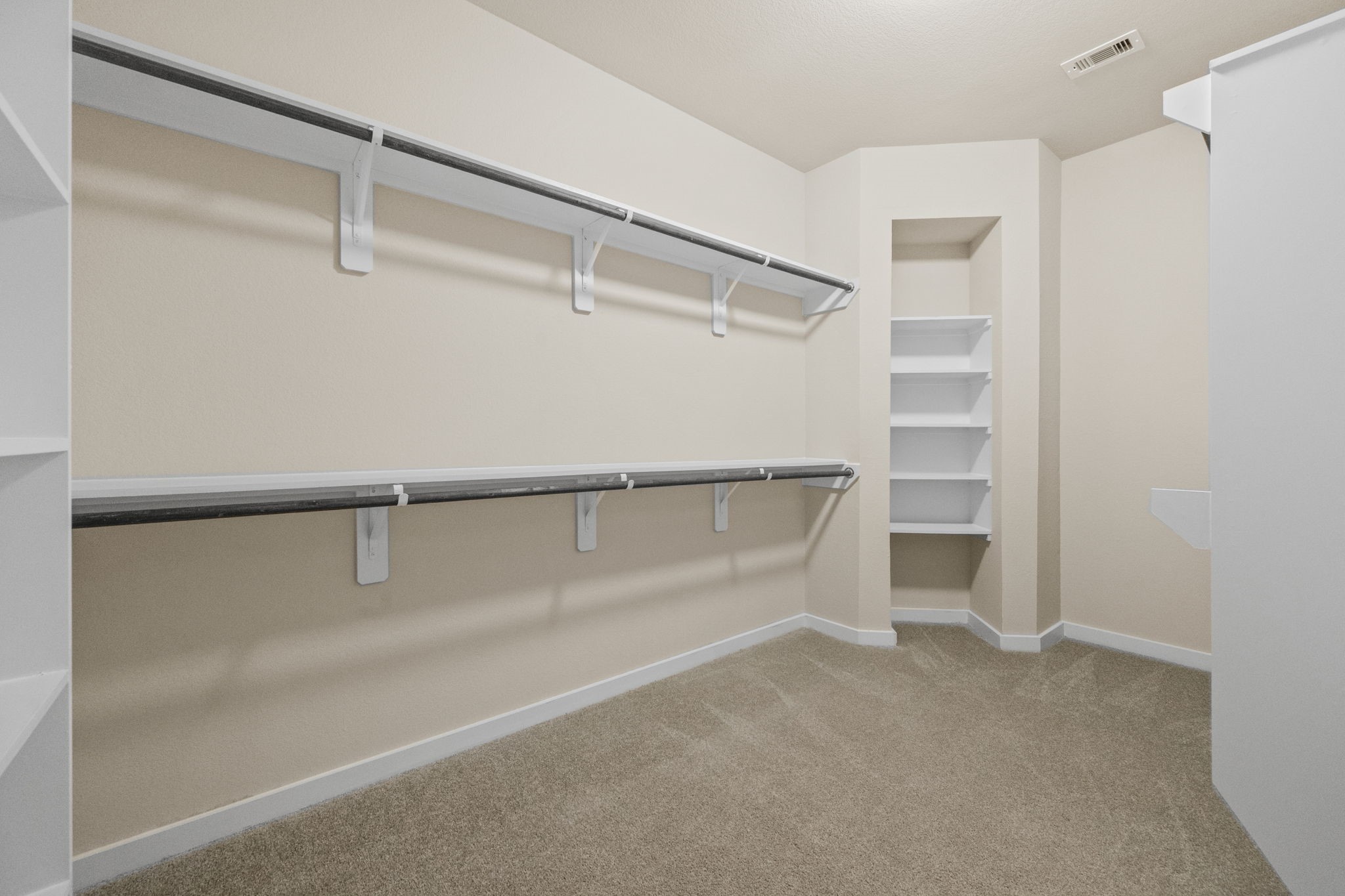 15666 Countesswells Drive Humble, TX 77346 - Photo 12 of 32 a view of walk in closet with empty racks