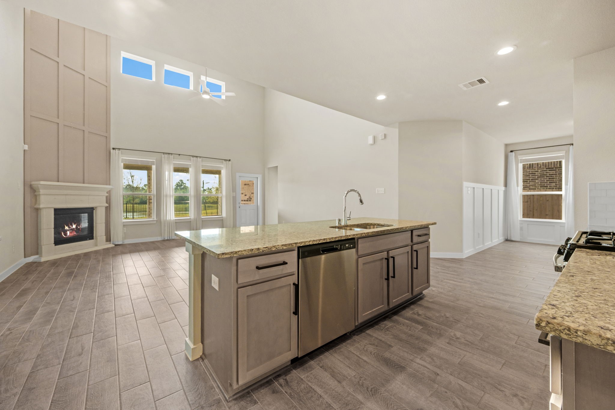 15666 Countesswells Drive Humble, TX 77346 - Photo 17 of 32 a large kitchen with granite countertop a stove and a sink