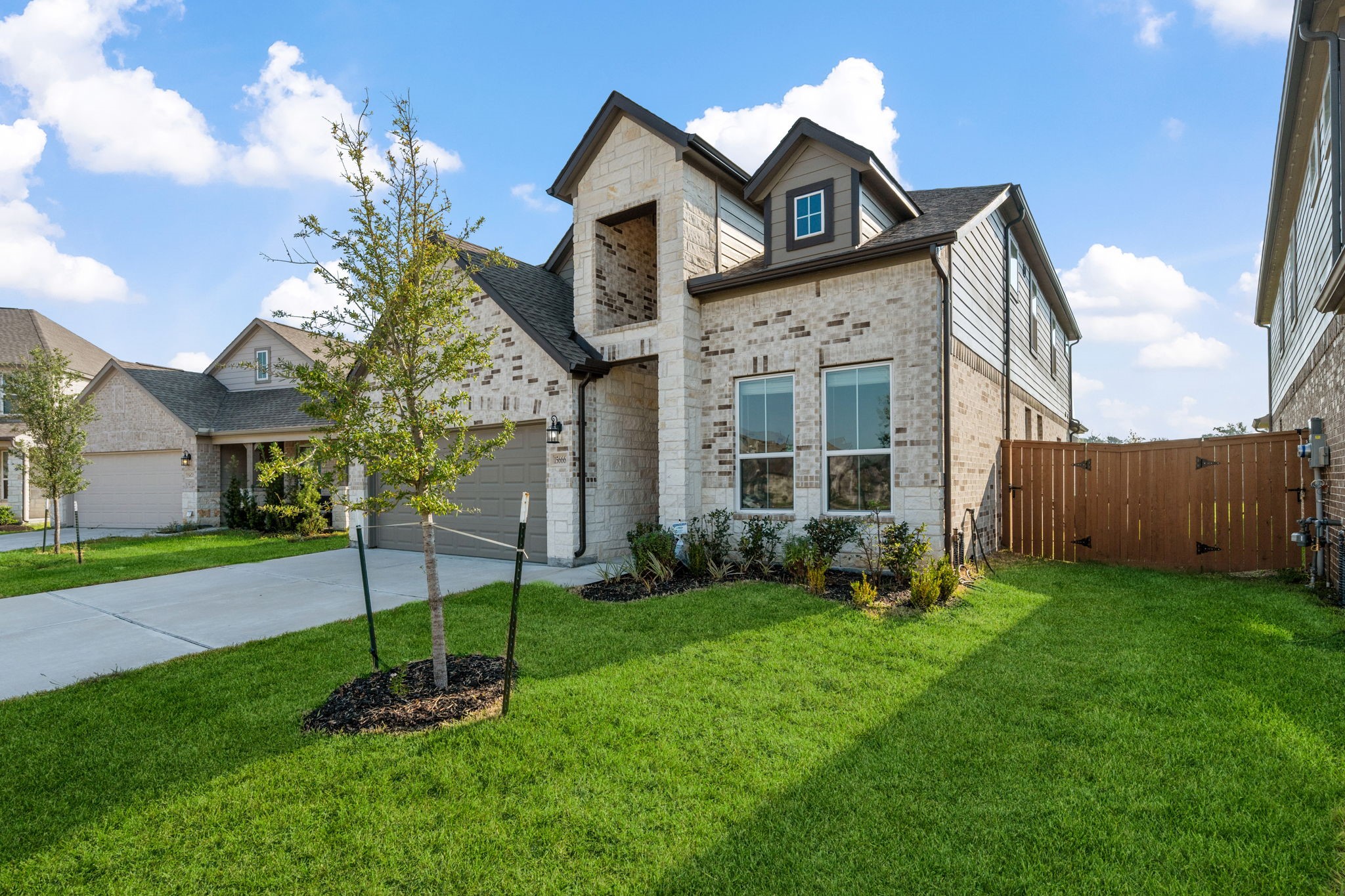 15666 Countesswells Drive Humble, TX 77346 - Photo 21 of 32 a front view of a house with a yard and garage