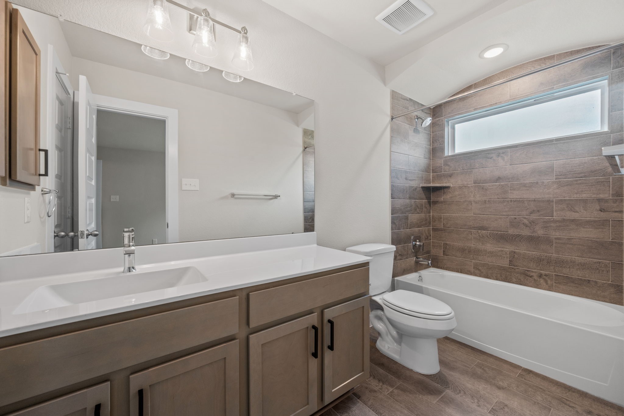15666 Countesswells Drive Humble, TX 77346 - Photo 24 of 32 a bathroom with a sink a toilet and shower