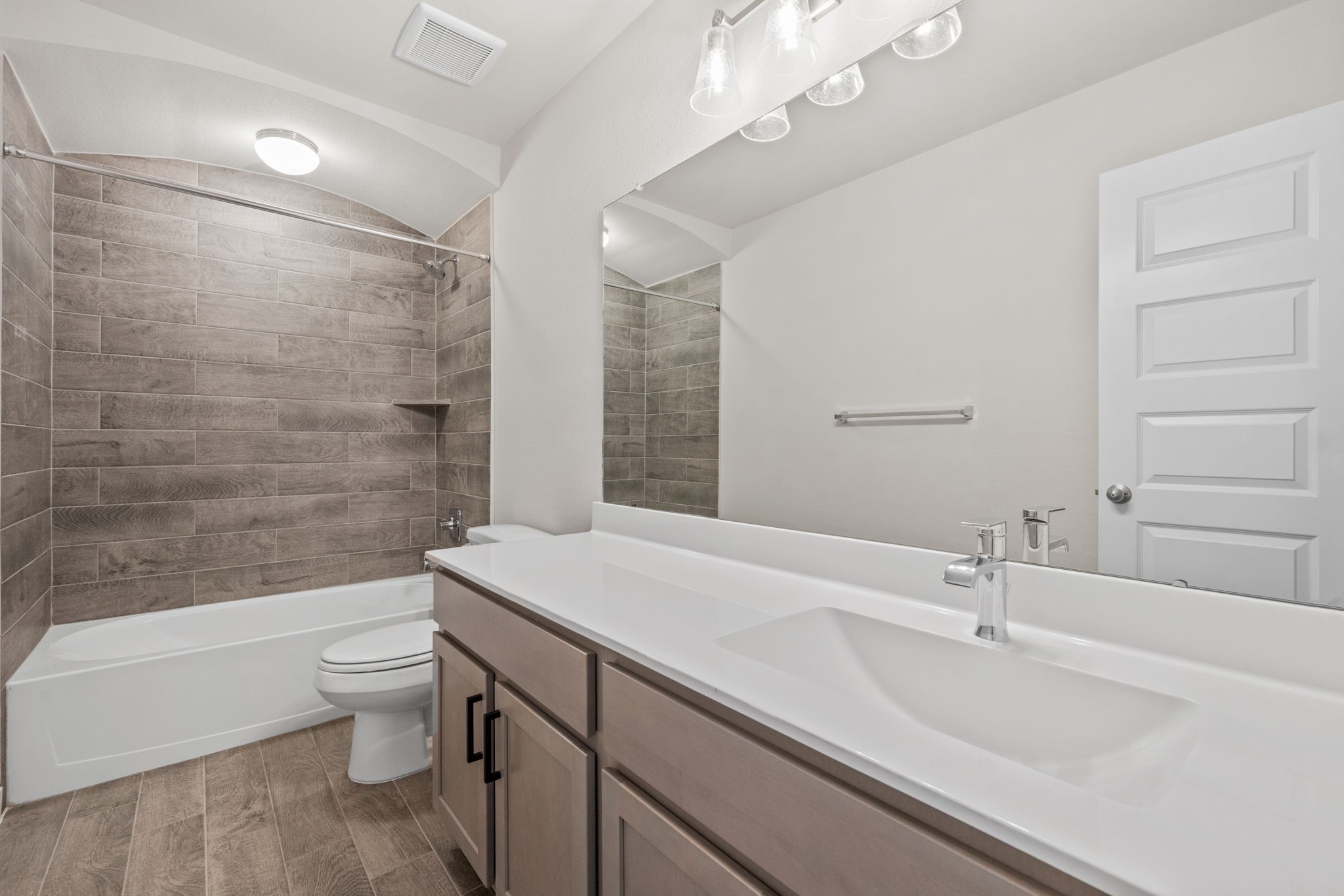15666 Countesswells Drive Humble, TX 77346 - Photo 28 of 32 a bathroom with a sink a toilet a mirror and shower