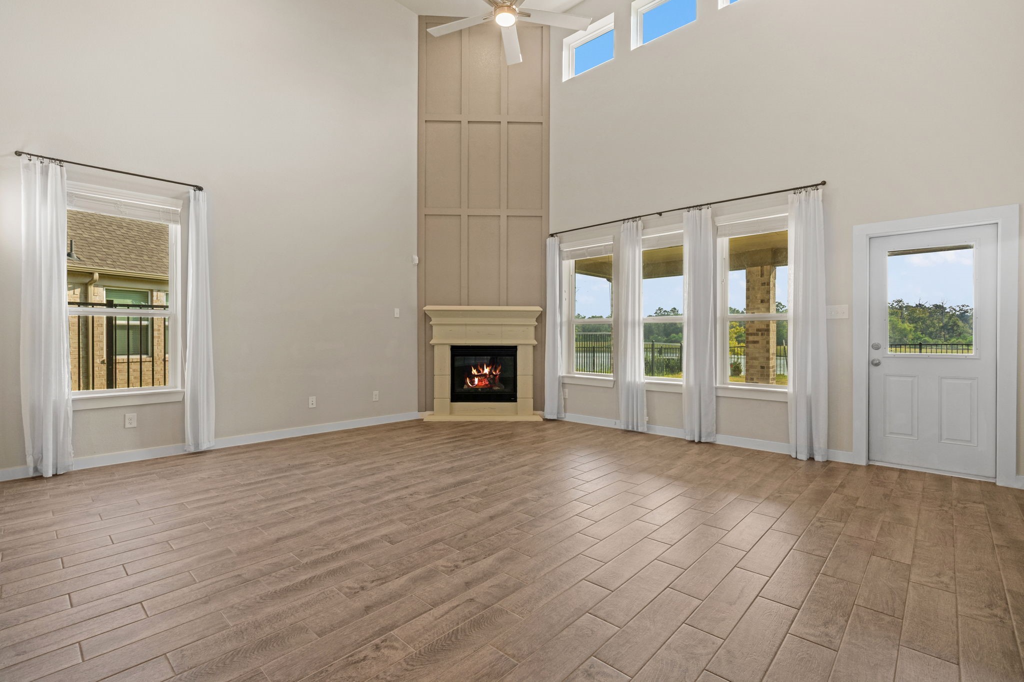 15666 Countesswells Drive Humble, TX 77346 - Photo 4 of 32 a view of empty room with wooden floor and fireplace