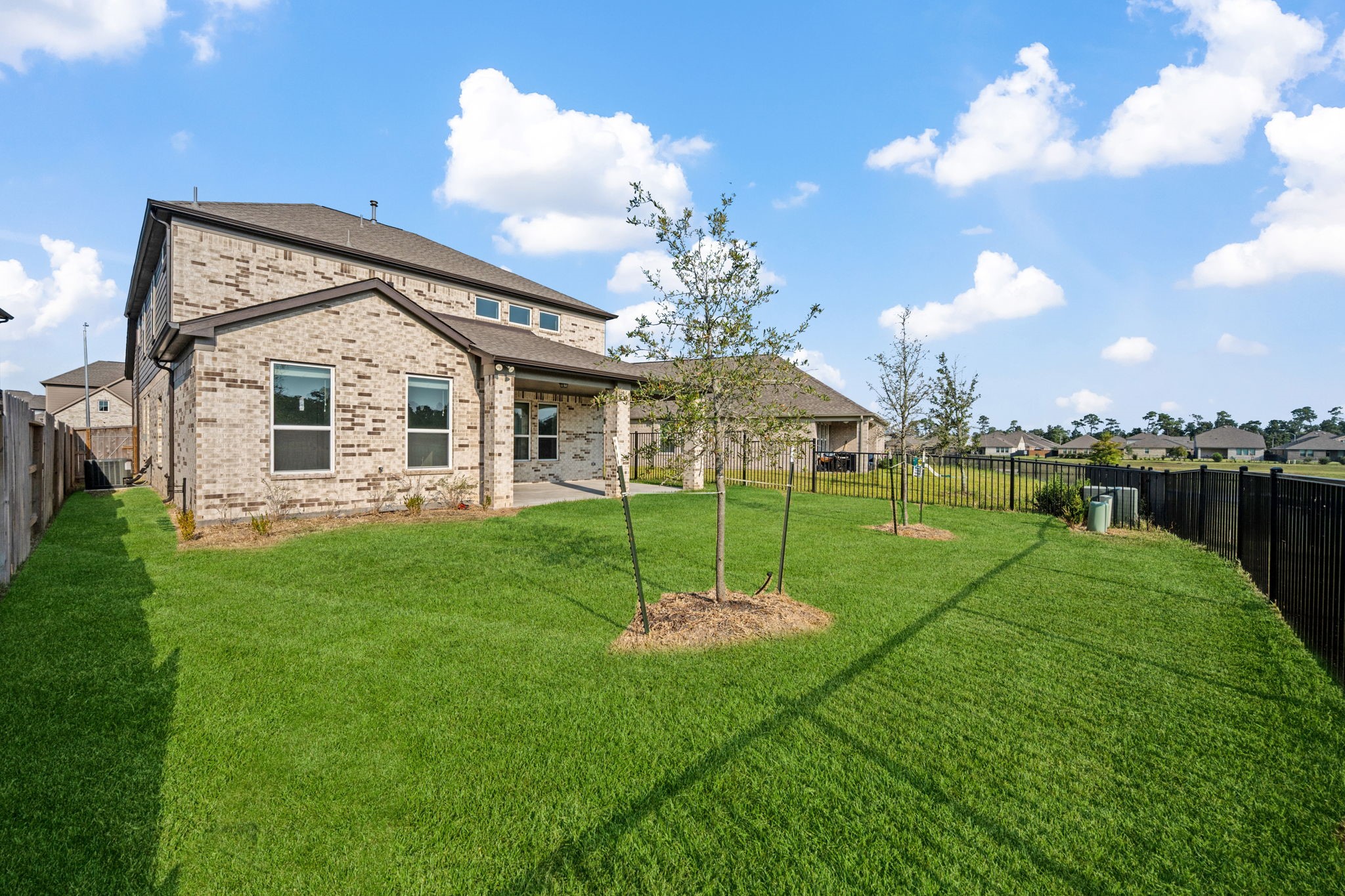15666 Countesswells Drive Humble, TX 77346 - Photo 6 of 32 a view of a house with a backyard and a fountain