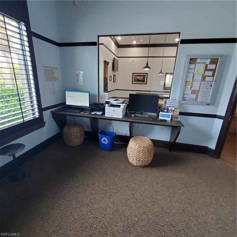 12980 Positano Circle, Unit 207 Naples, FL 34105 - Photo 17 of 23 a room with furniture and window