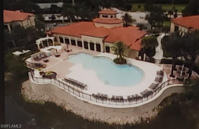 12980 Positano Circle, Unit 207 Naples, FL 34105 - Photo 21 of 23 a view of a house with swimming pool
