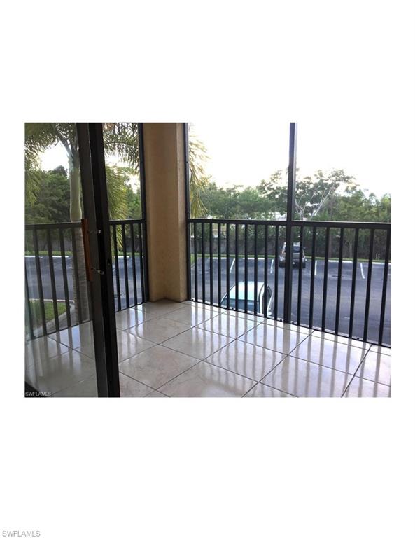 12980 Positano Circle, Unit 207 Naples, FL 34105 - Photo 9 of 23 a black and white photo of a lake