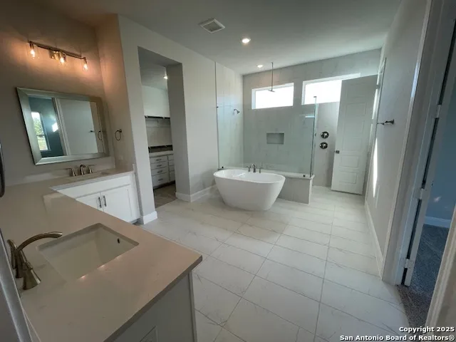 a bathroom with a sink and mirror