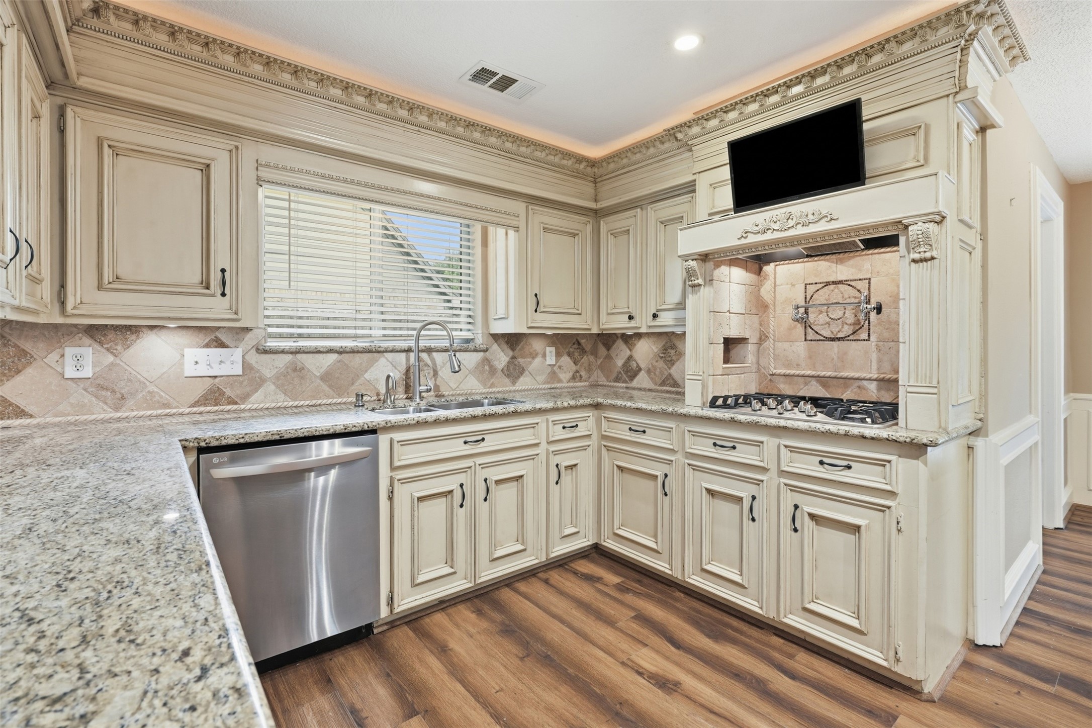 8310 Mentmore Drive Spring, TX 77379 - Photo 17 of 47 Enjoy preparing meals while remaining connected to the adjacent living and breakfast areas.