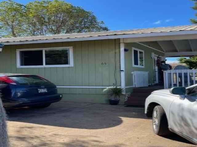 650 Papipi Road Kula, HI 96790 - Photo 2 of 15 a car parked in front of a house