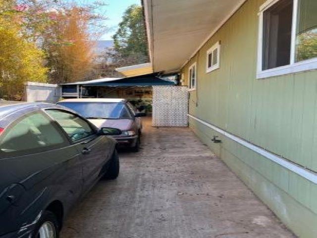 650 Papipi Road Kula, HI 96790 - Photo 3 of 15 a front view of a house with a yard
