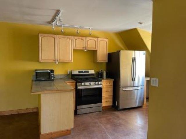 650 Papipi Road Kula, HI 96790 - Photo 4 of 15 a kitchen with a refrigerator and a stove