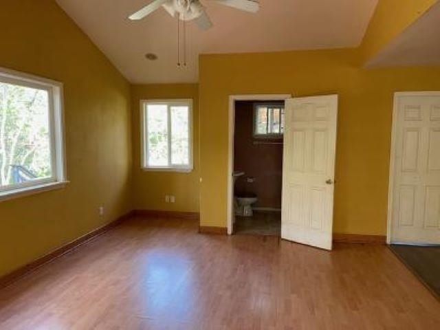 650 Papipi Road Kula, HI 96790 - Photo 7 of 15 a view of an empty room with a window and wooden floor