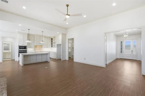 a view of kitchen with wooden floor and windows