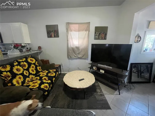 a living room with a couch and a flat screen tv