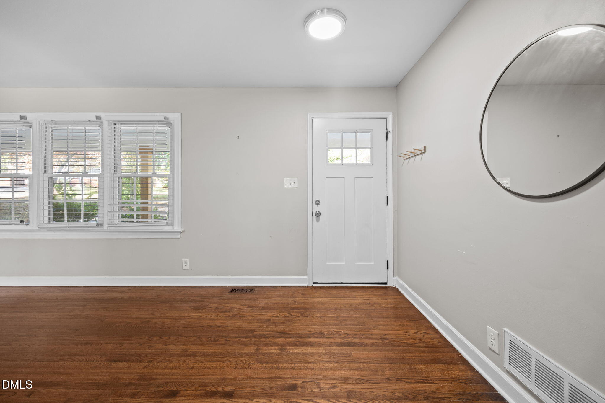 2950 Glenridge Drive Raleigh, NC 27604 - Photo 18 of 53 wooden floor in an empty room with a window