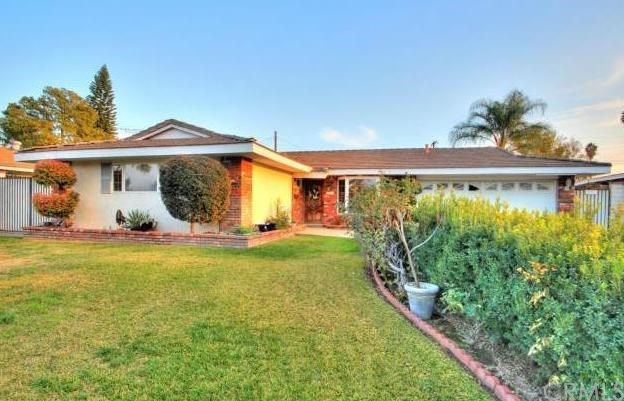 8840 Brunswick Avenue Riverside, CA 92503 - Photo 1 of 1 a front view of a house with garden