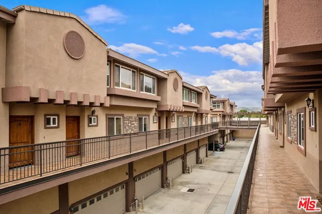 a view of a brick building with a balcony